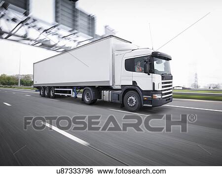 Freight truck on the move on motorway View Large Photo Image Stock Photograph - Freight truck on the move on motorway. Fotosearch