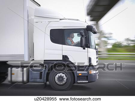 Freight truck on the move on motorway View Large Photo Image Stock Photography - Freight truck on the move on motorway. Fotosearch