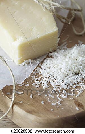 Stock Image - Grated parmesan, close-up. Fotosearch