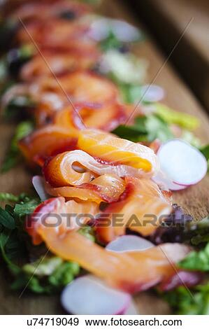 Stock Photo - Gravlax salmon salad, close up. Fotosearch