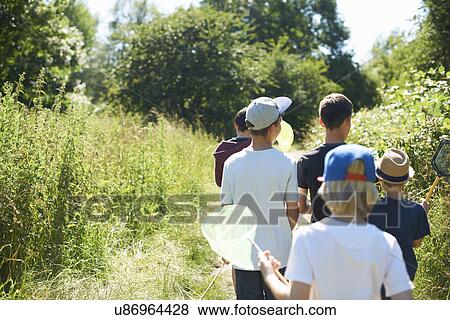 Group of boys in field View Large Photo Image Stock Photo - Group of boys in field. Fotosearch