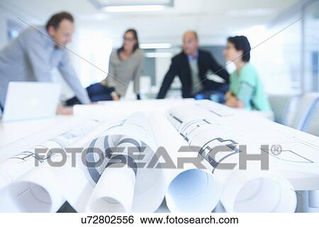 Group of business people discussing plans View Large Photo Image Stock Photograph - Group of business people discussing plans. Fotosearch