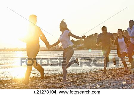 Group of friends having fun on beach View Large Photo Image Picture - Group of friends having fun on beach. Fotosearch