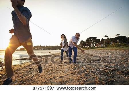 Group of friends having fun on beach View Large Photo Image Stock Photo - Group of friends having fun on beach. Fotosearch