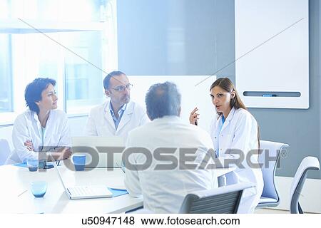 Group of researchers having meeting View Large Photo Image Stock Photo - Group of researchers having meeting. Fotosearch