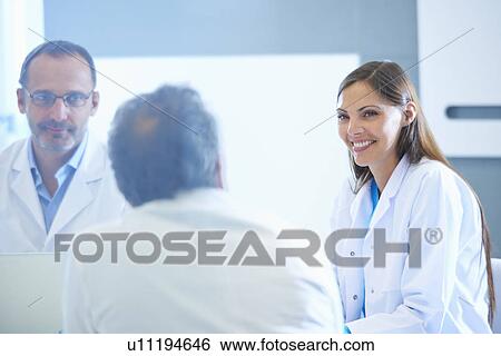 Group of researchers having meeting View Large Photo Image Stock Photograph - Group of researchers having meeting. Fotosearch