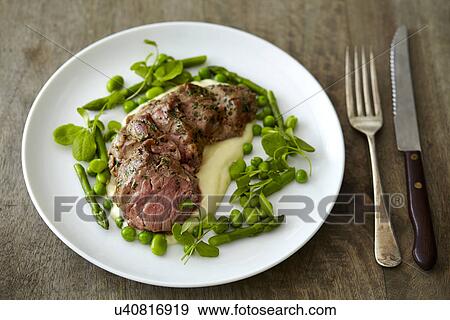 Lamb and vegetables on white plate View Large Photo Image Stock Photo - Lamb and vegetables on white plate. Fotosearch