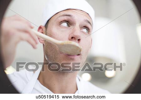 Male chef tasting food from saucepan in commercial kitchen View Large Photo Image Stock Photography - Male chef tasting food from saucepan in commercial kitchen. Fotosearch