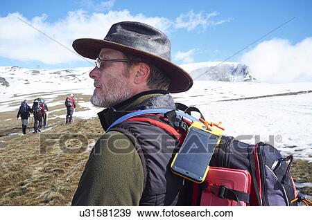 Stock Photo - Man hiking, Bucegi Mountains, Transylvania. Fotosearch