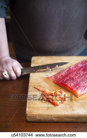 Picture - Man making gravlax. Fotosearch