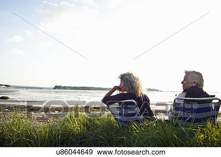 Mother and daughter enjoying view on beach View Large Photo Image Stock Photo - Mother and daughter enjoying view on beach. Fotosearch