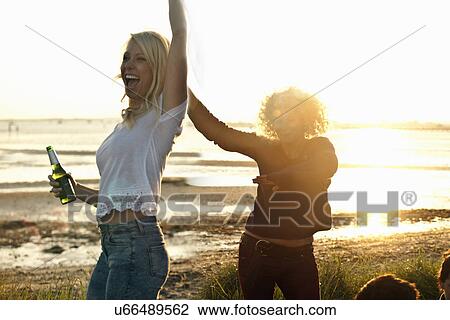 Mother and daughter partying on Bournemouth beach, Dorset, UK View Large Photo Image Stock Image - Mother and daughter partying on Bournemouth beach, Dorset, UK. Fotosearch