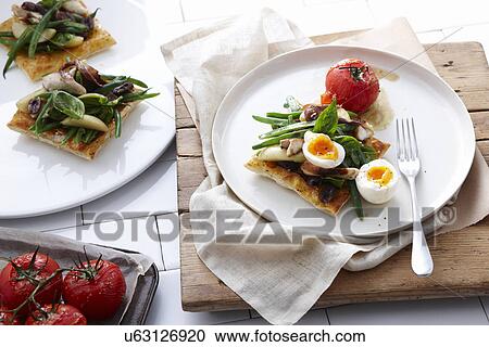 Nicoise tart with barbecued fish View Large Photo Image Stock Image - Nicoise tart with barbecued fish. Fotosearch