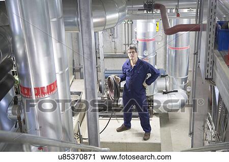Stock Image - Portrait of an engineer in power station. Fotosearch