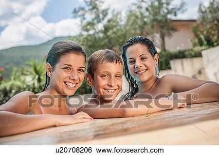 Portrait of boy and two sisters in swimming pool, Capoterra, Sardinia, Italy View Large Photo Image Stock Photograph - Portrait of boy and two sisters in swimming pool, Capoterra, Sardinia, Italy. Fotosearch