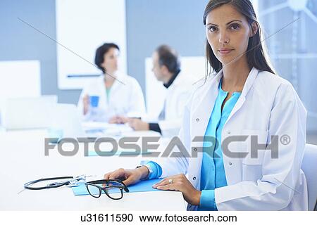 Stock Image - Portrait of female doctor. Fotosearch