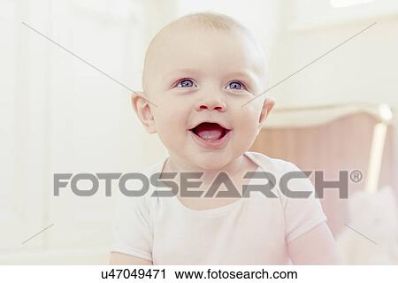 Stock Image - Portrait of smiling baby boy. Fotosearch