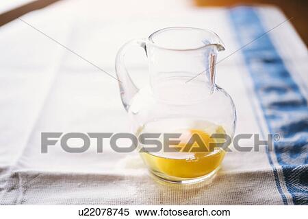 Raw egg in glass jug View Large Photo Image Stock Photography - Raw egg in glass jug. Fotosearch