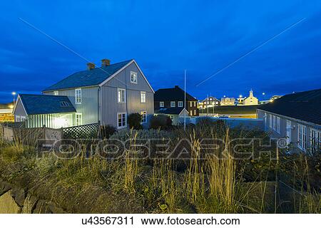 Stock Image - Residential homes at dusk, Stykkisholmur, Snaefellsnes, Iceland. Fotosearch