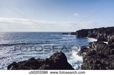 Stock Photograph - Sea and rocky coast, Lanzarote, Canary Islands, Spain. Fotosearch