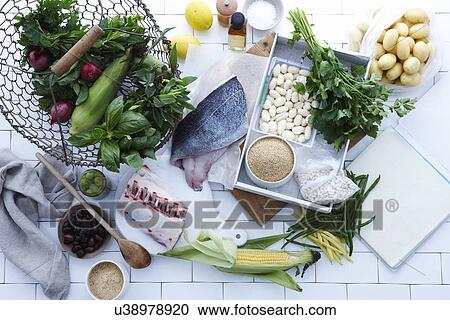 Stock Image - Selection of fresh fish, meat and vegetables. Fotosearch
