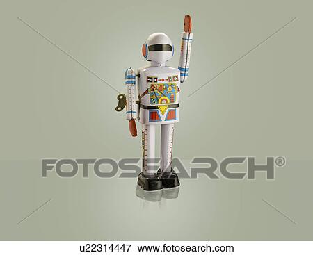 Studio shot of astronaut robot with arm raised View Large Photo Image Stock Photo - Studio shot of astronaut robot with arm raised. Fotosearch