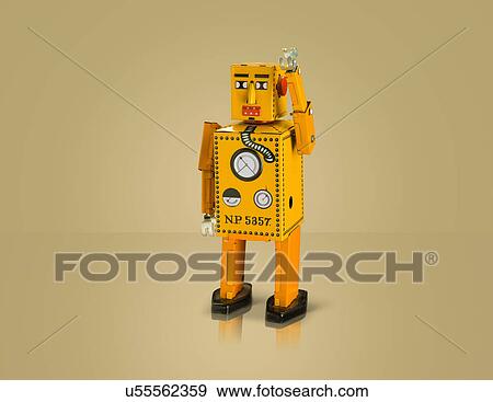 Studio shot of yellow robot with arm raised View Large Photo Image Stock Photo - Studio shot of yellow robot with arm raised. Fotosearch