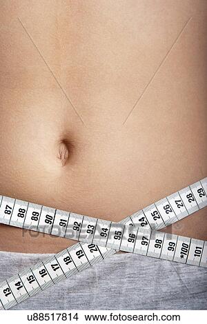 Tape measure around waist View Large Photo Image Picture - Tape measure around waist. Fotosearch
