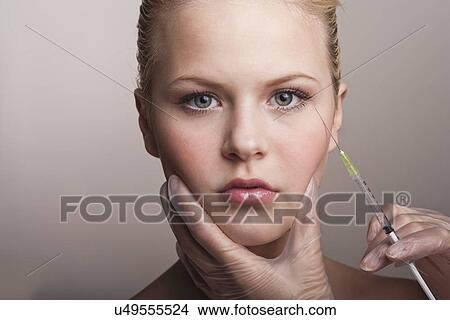 Teenage girl having neurotoxin injection View Large Photo Image Picture - Teenage girl having neurotoxin injection. Fotosearch