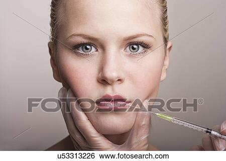 Teenage girl having neurotoxin injection View Large Photo Image Stock Photograph - Teenage girl having neurotoxin injection. Fotosearch