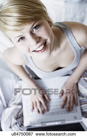 Teenage girl using laptop, high angle View Large Photo Image Stock Photo - Teenage girl using laptop, high angle. Fotosearch