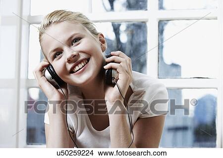 Teenage girl with headphones View Large Photo Image Picture - Teenage girl with headphones. Fotosearch