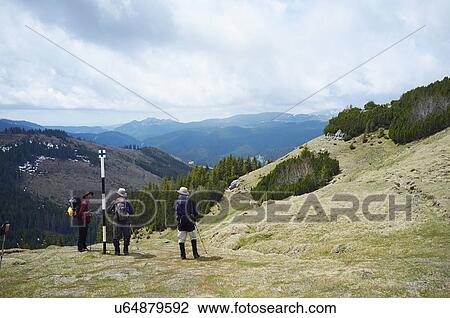 Three hikers, Bucegi Mountains, Transylvania, Romania View Large Photo Image Stock Image - Three hikers, Bucegi Mountains, Transylvania, Romania. Fotosearch