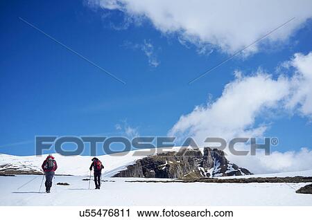 Two men hiking in snow, Bucegi Mountains, Transylvania, Romania View Large Photo Image Stock Image - Two men hiking in snow, Bucegi Mountains, Transylvania, Romania. Fotosearch