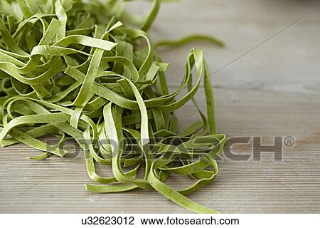Uncooked tagliatelle pasta View Large Photo Image Stock Image - Uncooked tagliatelle pasta. Fotosearch