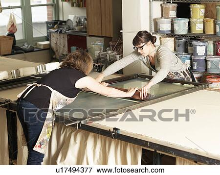 Women hand-printing textile in workshop View Large Photo Image Stock Photo - Women hand-printing textile in workshop. Fotosearch
