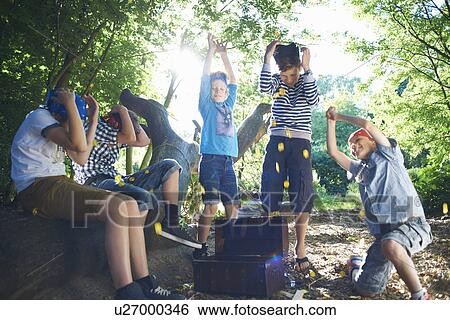 Young boys dressed as pirates with treasure chest View Large Photo Image Stock Photograph - Young boys dressed as pirates with treasure chest. Fotosearch