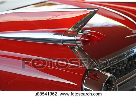 Stock Image - Close up of a vintage red car. Fotosearch