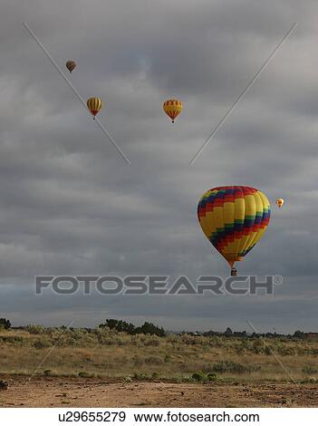 Flying hot air balloons View Large Photo Image Stock Photo - Flying hot air balloons . Fotosearch