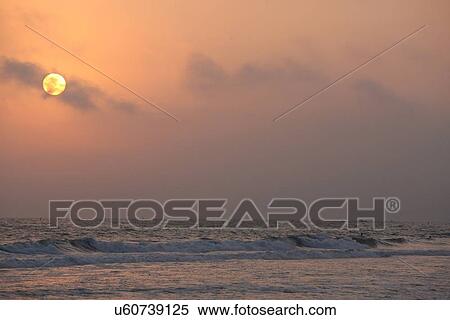 Stock Photography - Sunset at sea. Fotosearch