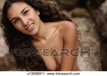 Stock Image - Topless woman looking at camera. Fotosearch