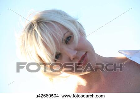 Picture - Woman looking at camera. Fotosearch
