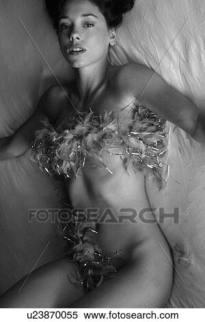 Woman wearing a feather boa View Large Photo Image Stock Photography - Woman wearing a feather boa . Fotosearch