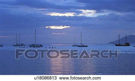 Stock Image - Yachts at sunset . Fotosearch
