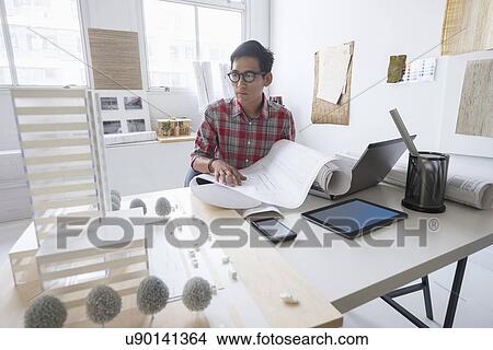Picture - Architect working in office. Fotosearch