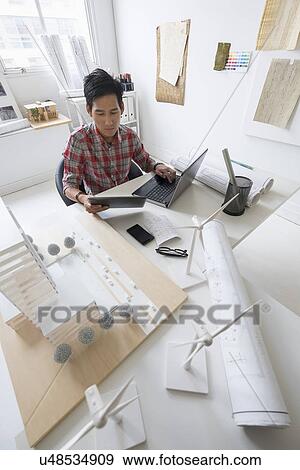 Architect working in office View Large Photo Image Stock Photo - Architect working in office. Fotosearch