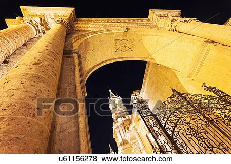 Stock Photo - Cathedral on Plaza de Armas seen from triumphal arch. Fotosearch