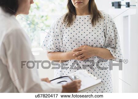 Stock Photo - Check up visit in doctor's office. Fotosearch