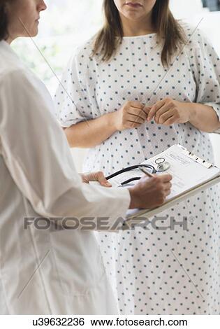 Stock Photograph - Check up visit in doctor's office. Fotosearch