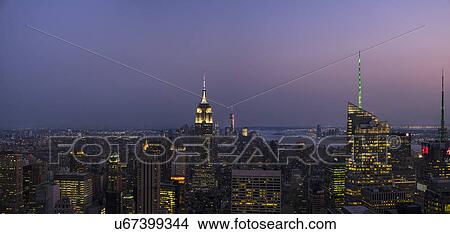 Picture - City skyline at dusk. Fotosearch